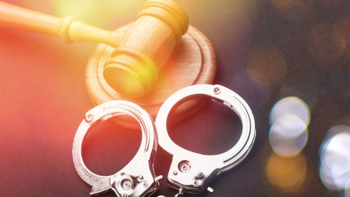 Judges gavel and handcuffs NAB share price exec jailed