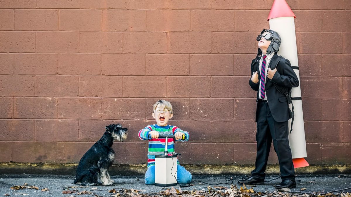 Two children and a dog get set to launch their friend rocketing high into the sky.