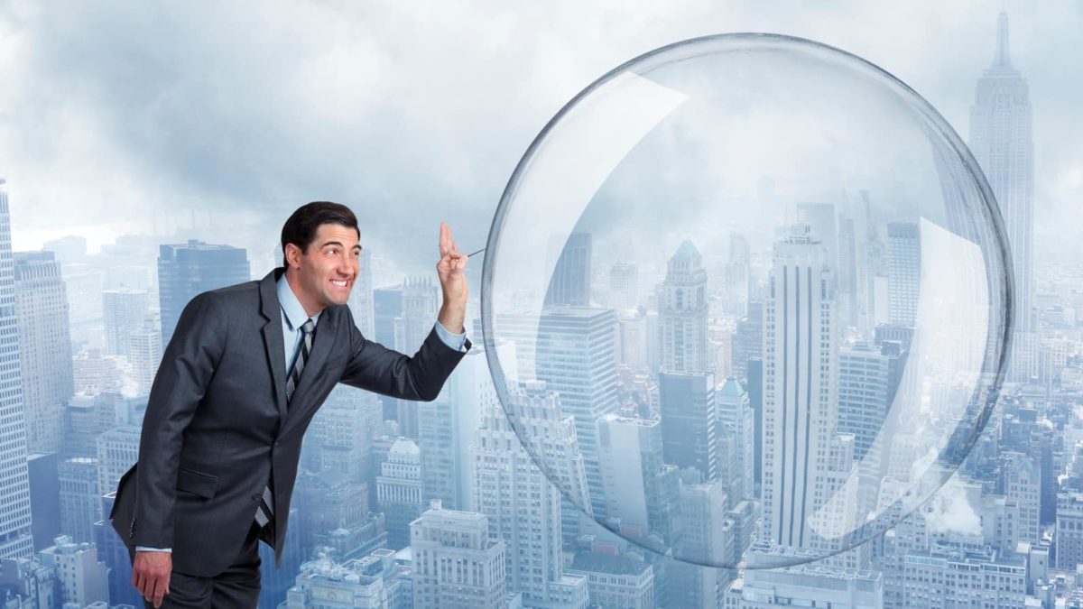 a man in a business suit leans in to burst a huge bubble with a pin, indicating a major share market crash