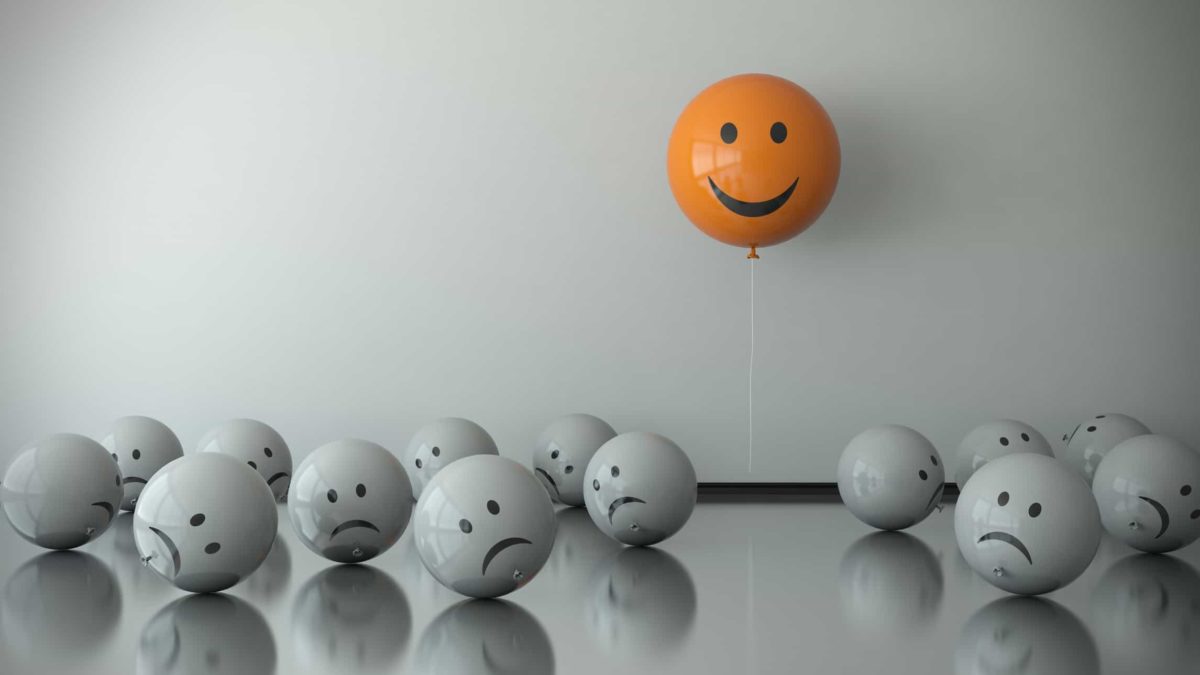 party of asx shares represented by happy orange balloon floating above sad grey balloons