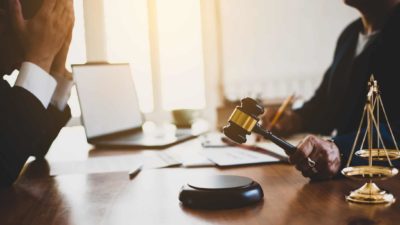 A sobbing businessman accused of wrongdoing faces justice