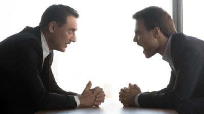 retail investor fighting with hedge fund short seller across table