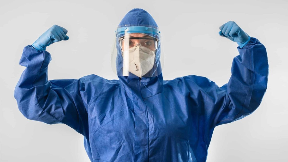 Starpharma share price A doctor or medical expert in COVID-19 protection flexes his muscle, indicating growth or strong share price movement in ASX medical, biotech and health companies