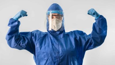 Starpharma share price A doctor or medical expert in COVID-19 protection flexes his muscle, indicating growth or strong share price movement in ASX medical, biotech and health companies