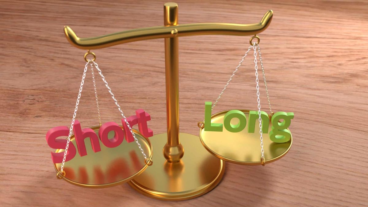 asx shares short sell represented by set of scales with the word short on one side and long on the other