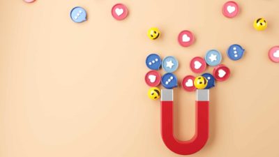 social media shares represented by magnet attracting various emojis