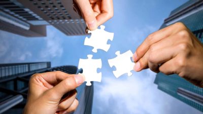 AMP share price demergerThree zigsaw pieces pulled apart to symbolise a demerger