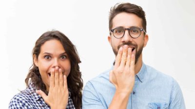 asx share price watch represented by two investors with happy surprised looks on faces