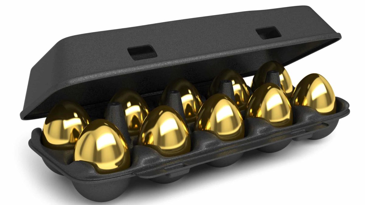 ASX gold shares buy investment represented by carton of golden eggs