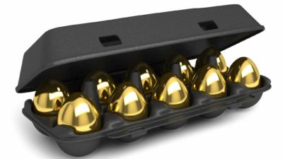 ASX gold shares buy investment represented by carton of golden eggs