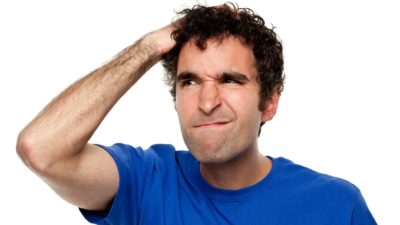 investor scratching head as if trying to decide whether to sell asx share price