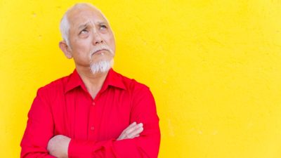 investor staring off into the distance wondering when Flight Centre might pay a dividend again as the share price rises today