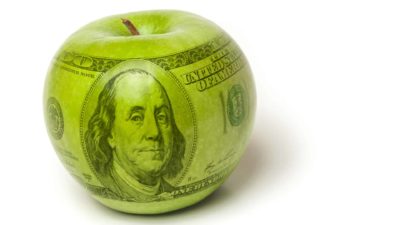 rising share price represented by apple with one hundred dollar bill printed on it