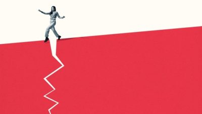 falling ASX share price represented by person trying to step over a crack