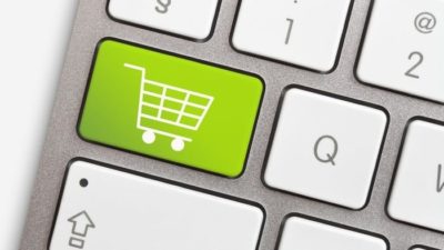 apple keyboard with a green shopping trolley key