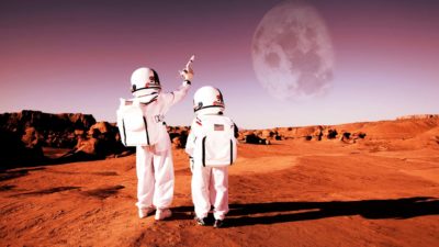 Two astronauts stand on themoon, indicating a rocketing share price