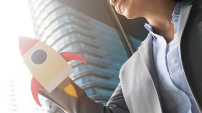 rocket picture covering the hand of a women