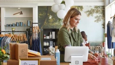 woman working at the counter of her store
