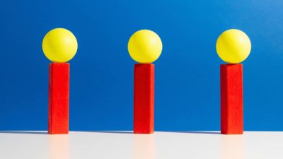 Three brightly coloured objects against a backdrop of blue, indication three winning ASX share prices