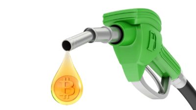 bitcoin symbol in drop of fuel from fuel pump