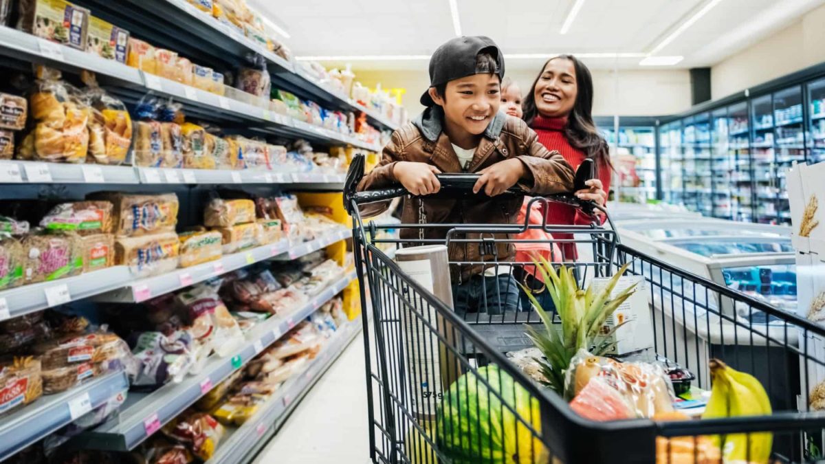 Family having fun while shopping for groceries.