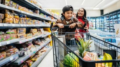Family having fun while shopping for groceries.