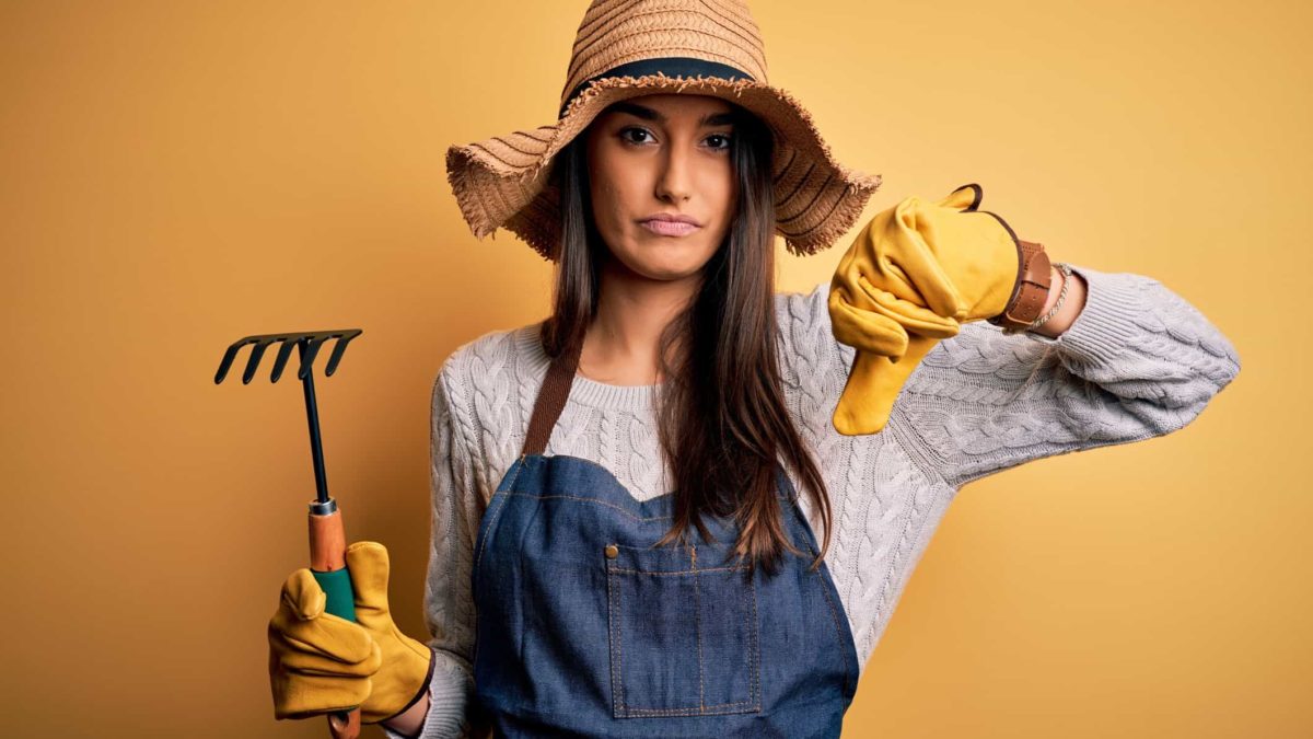 disappointed woman farmer at the decline of share price