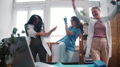 rising medical asx share price represented by excited doctors dancing in ward