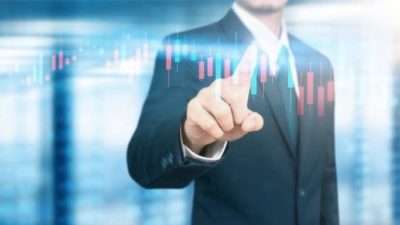 man touching a digital financial chart