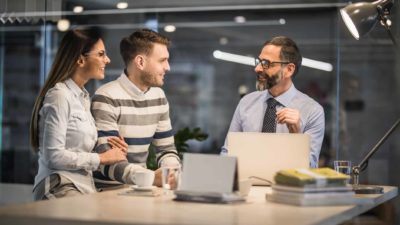 couple having a happy discussion with a banker