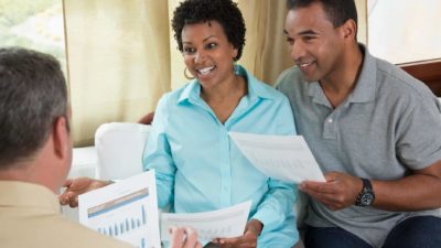 a couple getting financial advice from a consultant