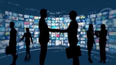 people blacked out standing in front of screens of different movies and tv shows