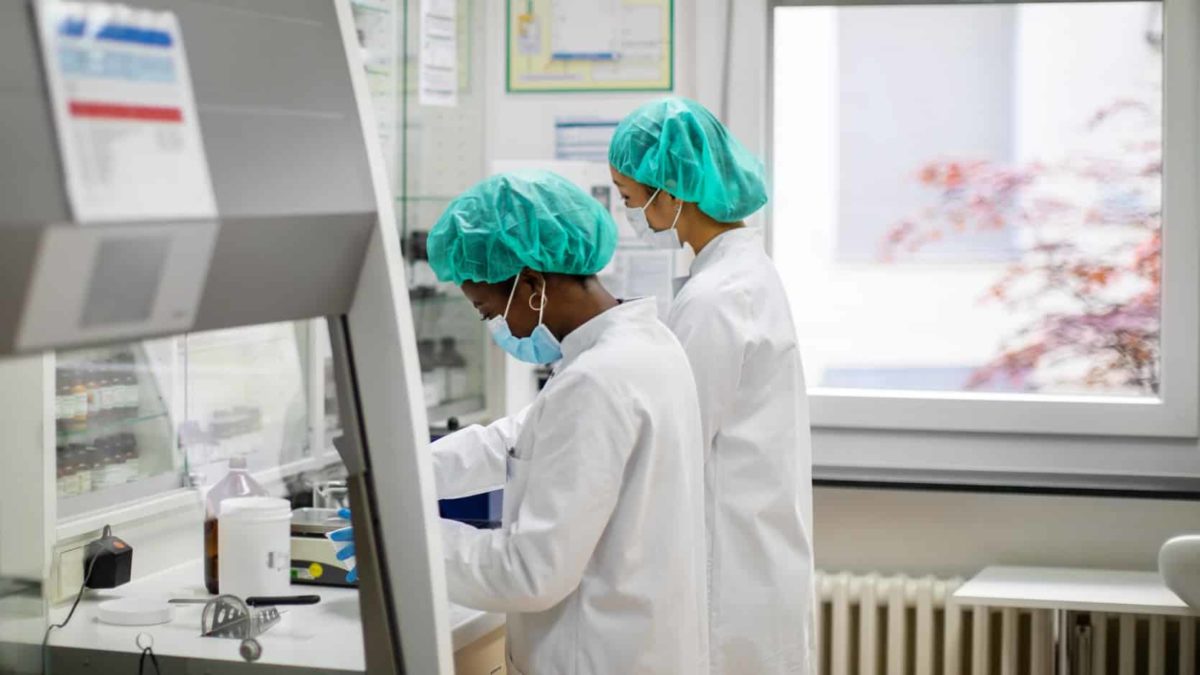 Two lab technicians carrying out clinical trials