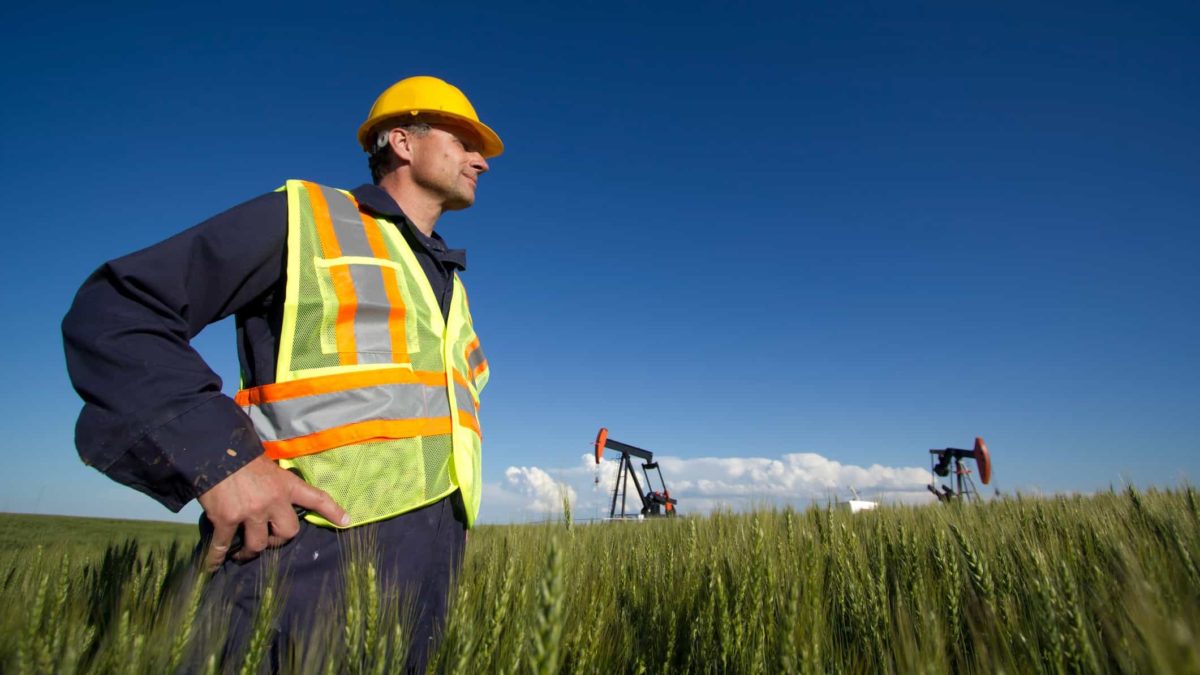 hard hat worker at green mining site