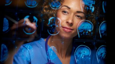 medical imaging doctor amid images of human brains