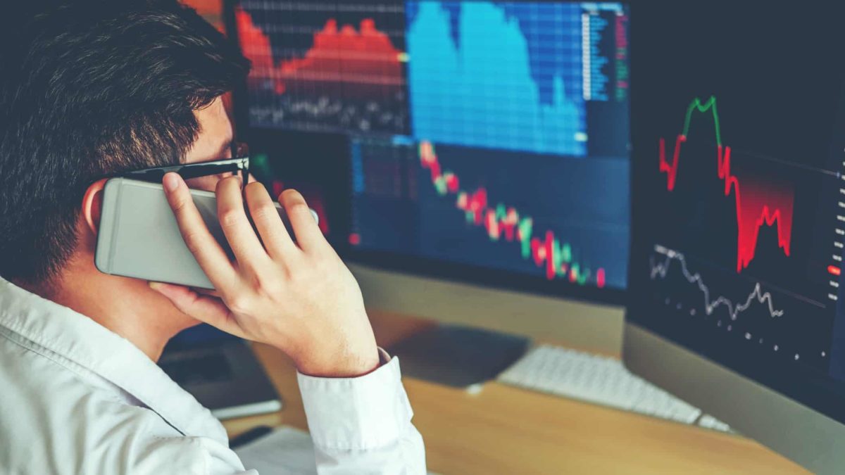 man on phone researching Fintech reports