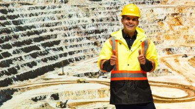 Miner with thumbs up at mine