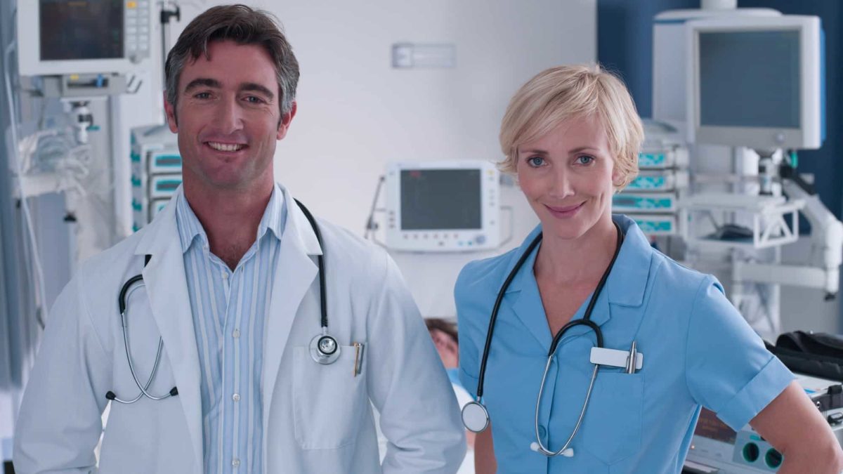 doctor and nurse smiling in a hospital ward representing rising share price