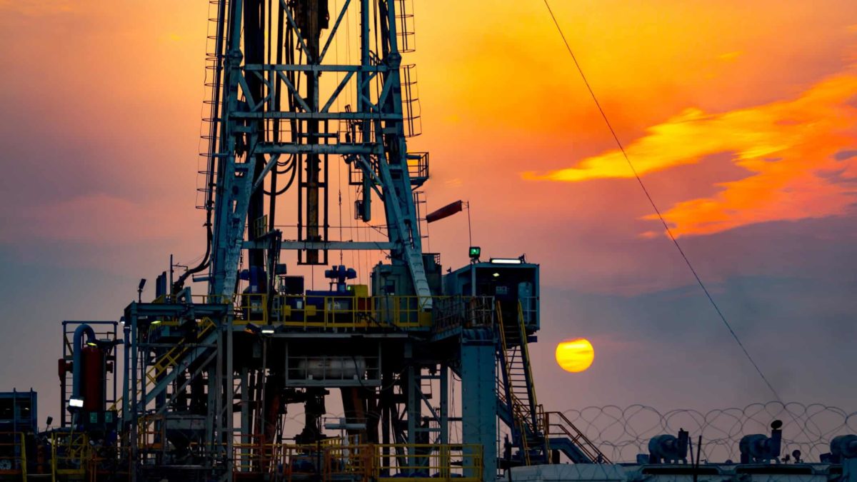 off shore drilling operation at sunset