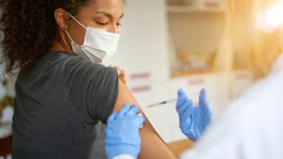 woman receiving vaccine