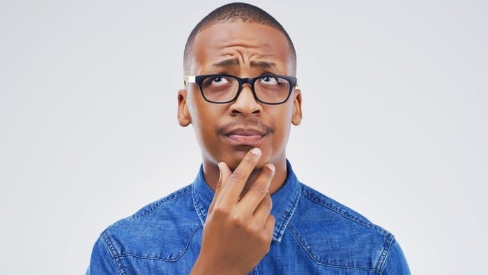 man with his hand on his chin wondering about the AIM share price