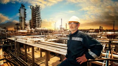 worker in hard hat at an oil refinery