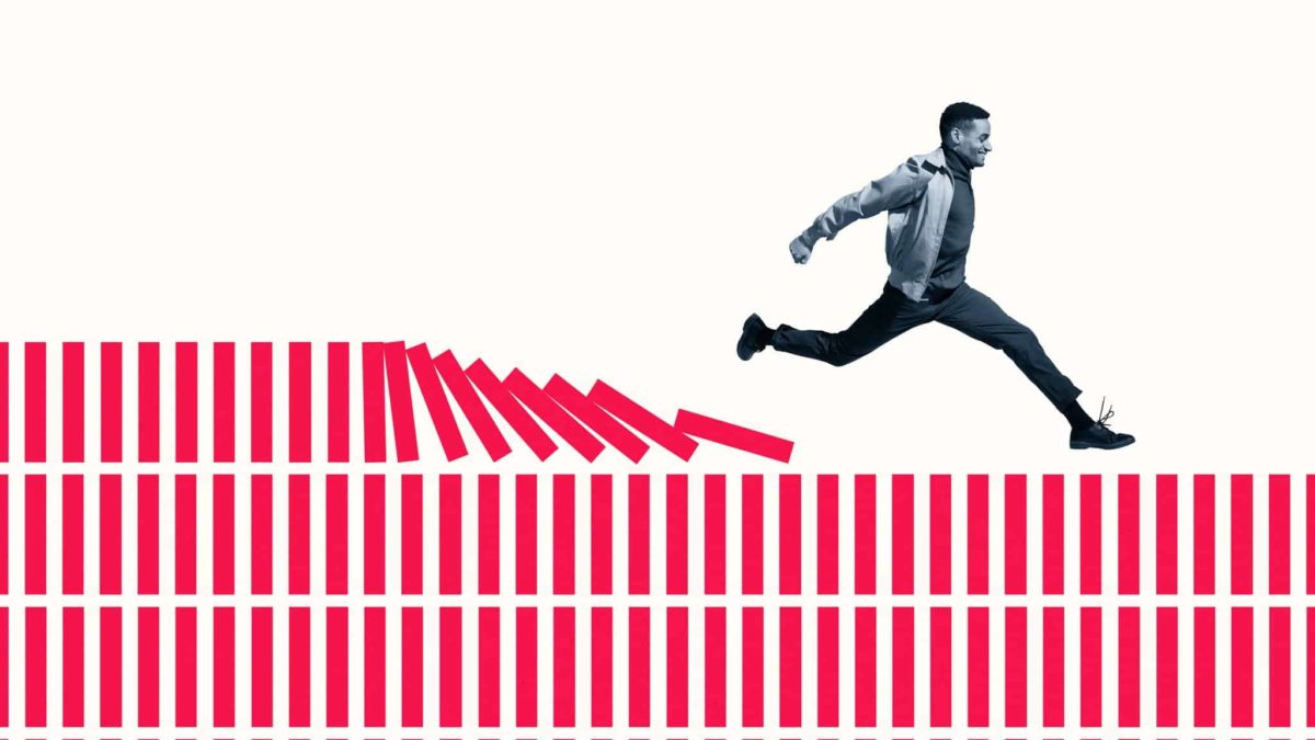 An ASX 200 share investor runs and leaps over rows and rows of blocks, as they topple in his wake.