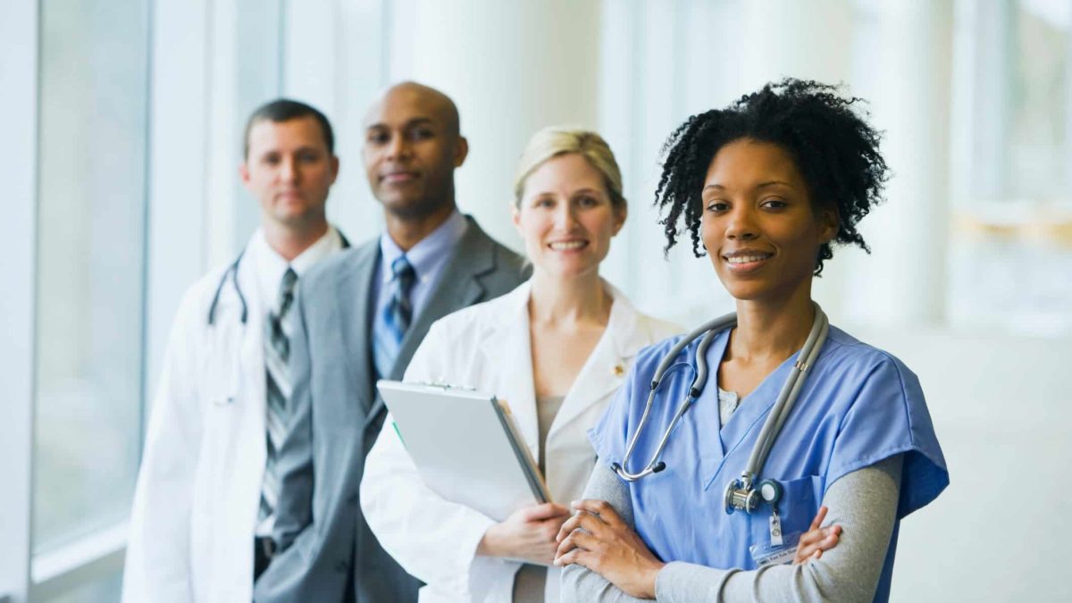 smiling health care workers in a medical setting