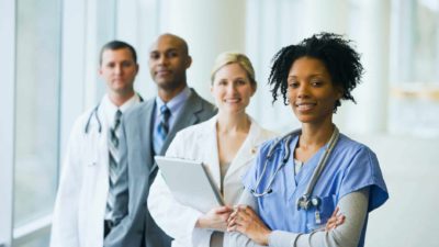 smiling health care workers in a medical setting