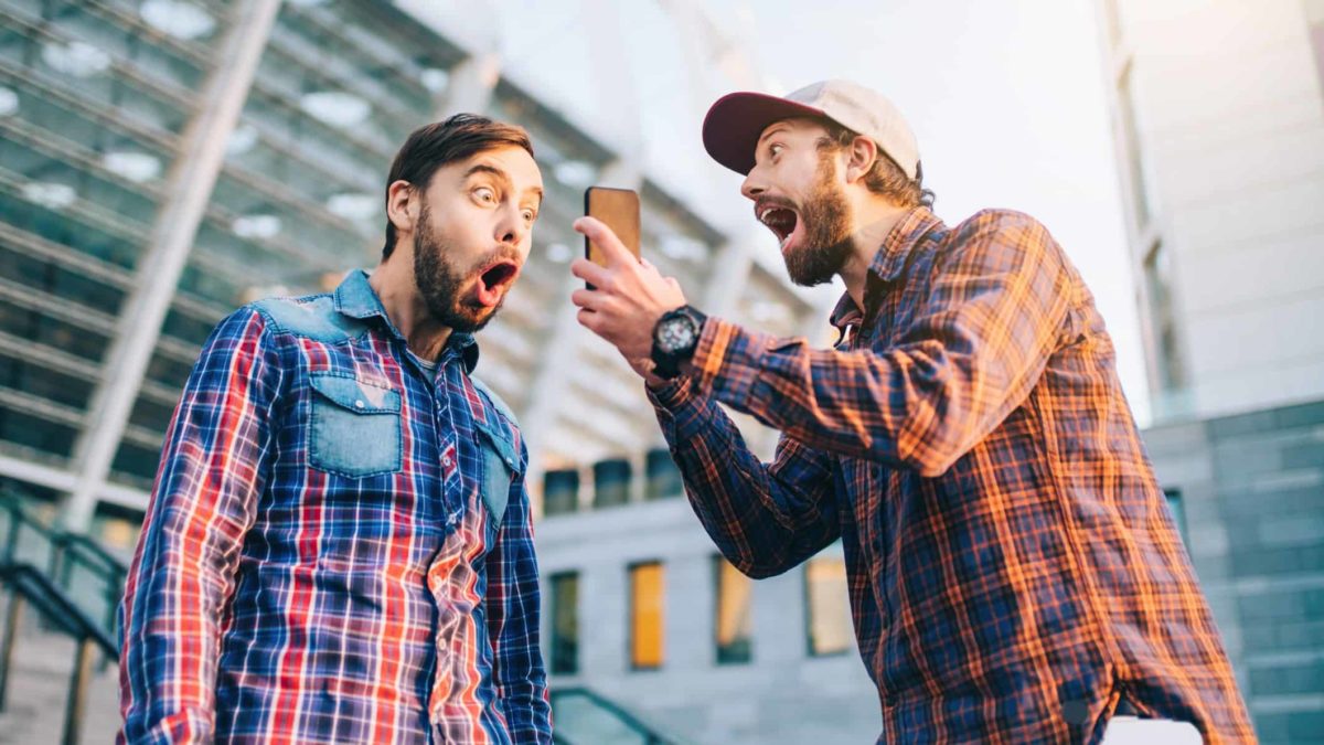 Two men excited to win online bet