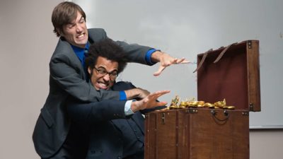 Two ASX shares investors fighting each other to grab gold treasure.