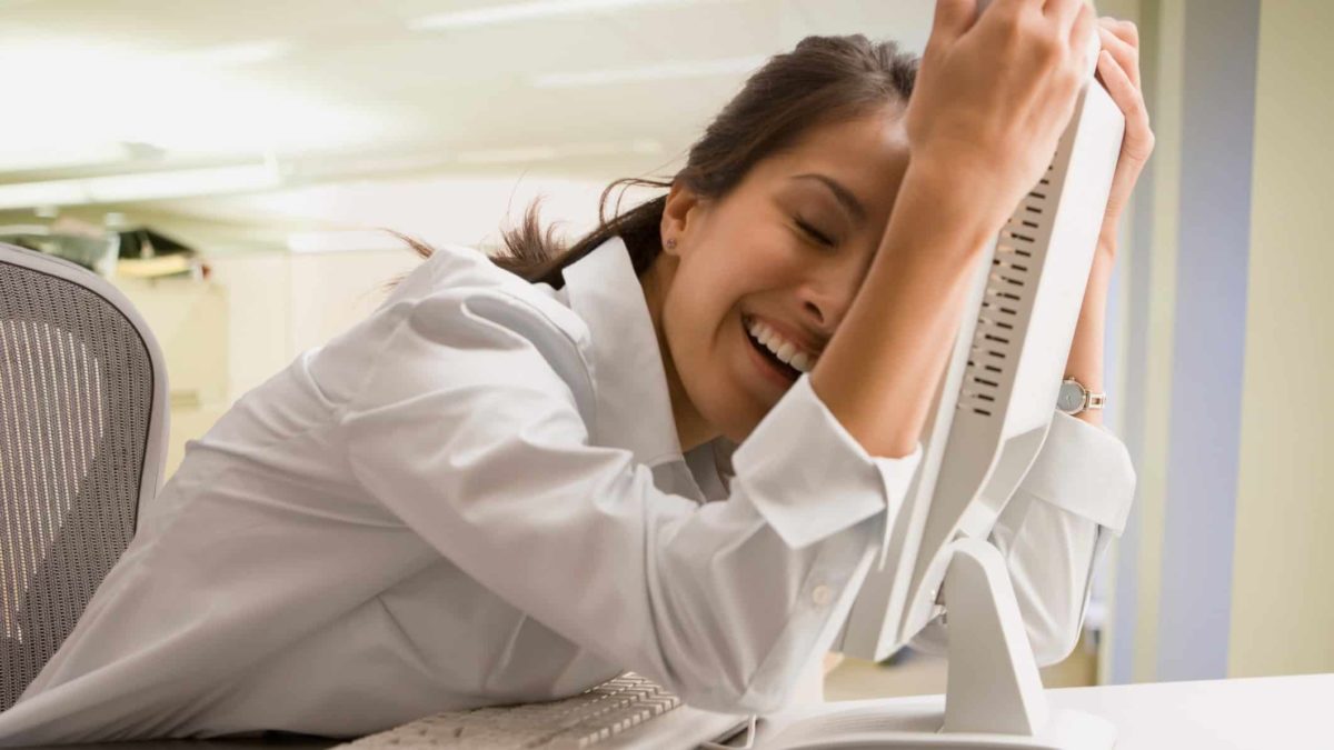 relived woman hugs computer