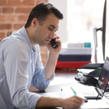 man investing and working from home