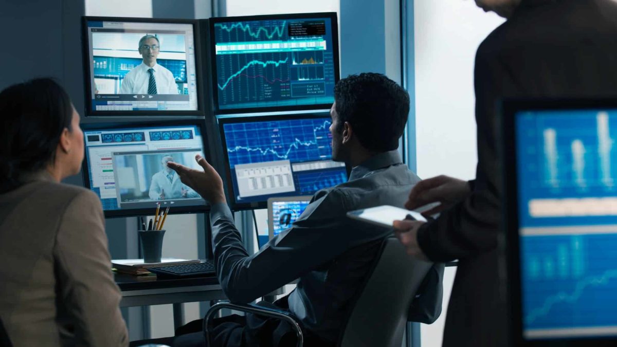 Man online with computers discussing the ASX 200